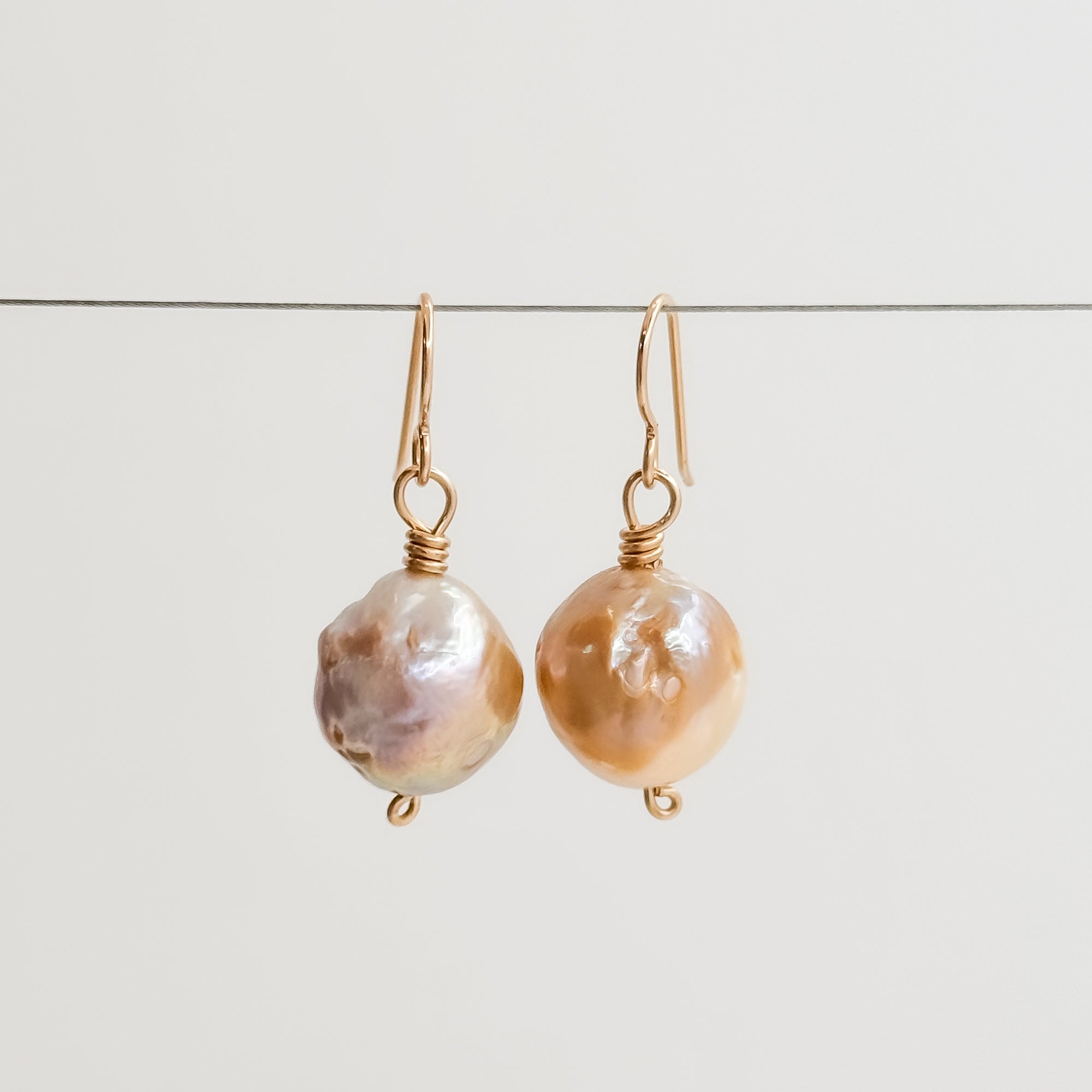 Single large Champagne Baroque pearl earrings