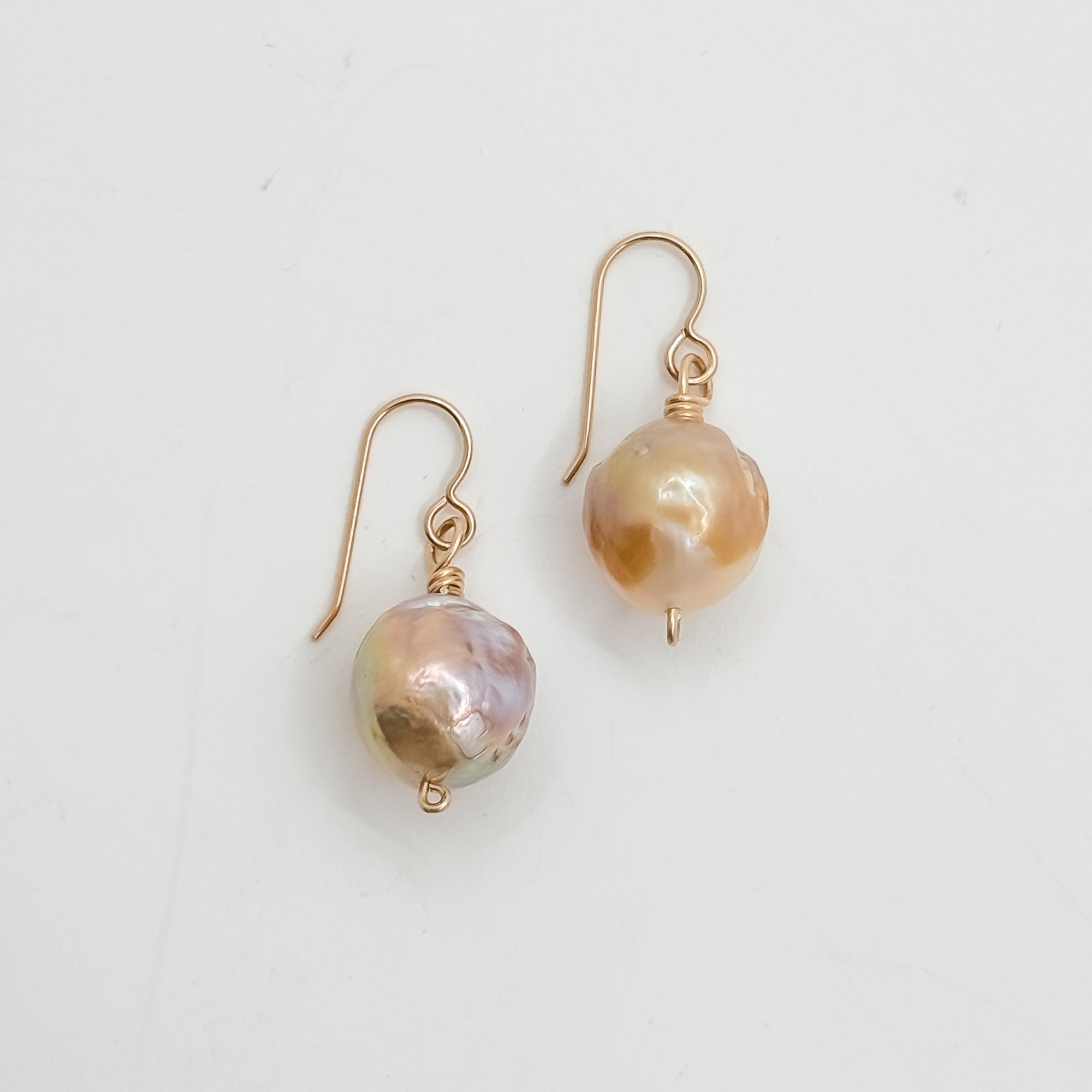 Single large Champagne Baroque pearl earrings
