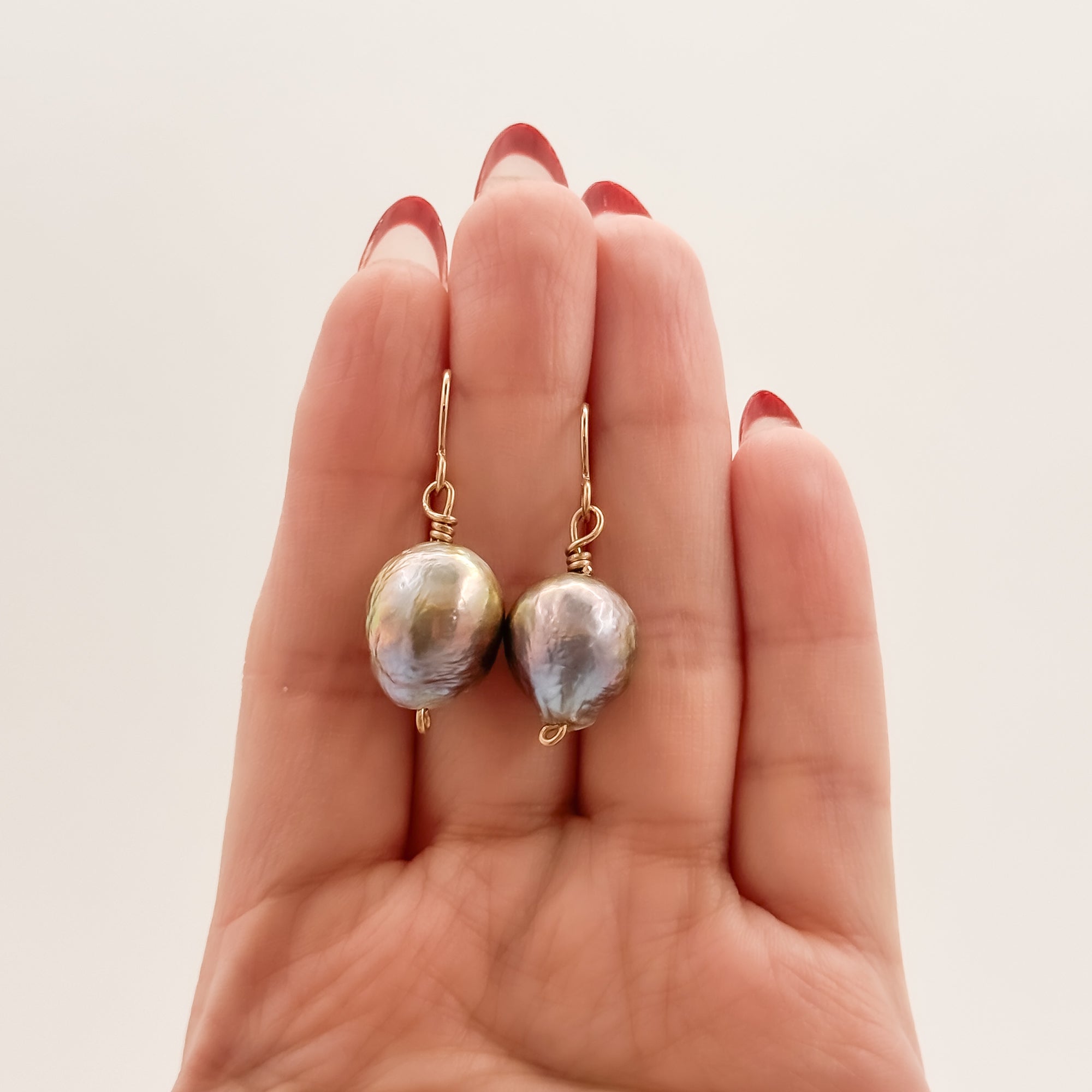 Single large Peacock Baroque pearl earrings