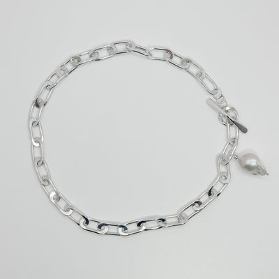 Tow Truck Jr with baroque pearl necklace