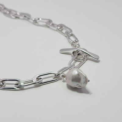 Tow Truck Jr with baroque pearl necklace