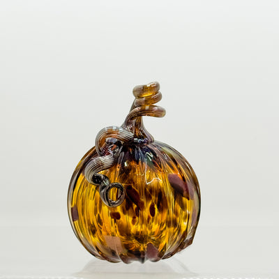 Medium curly stem pumpkin in amber