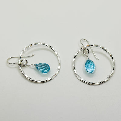 Hoop earrings with topaz drop