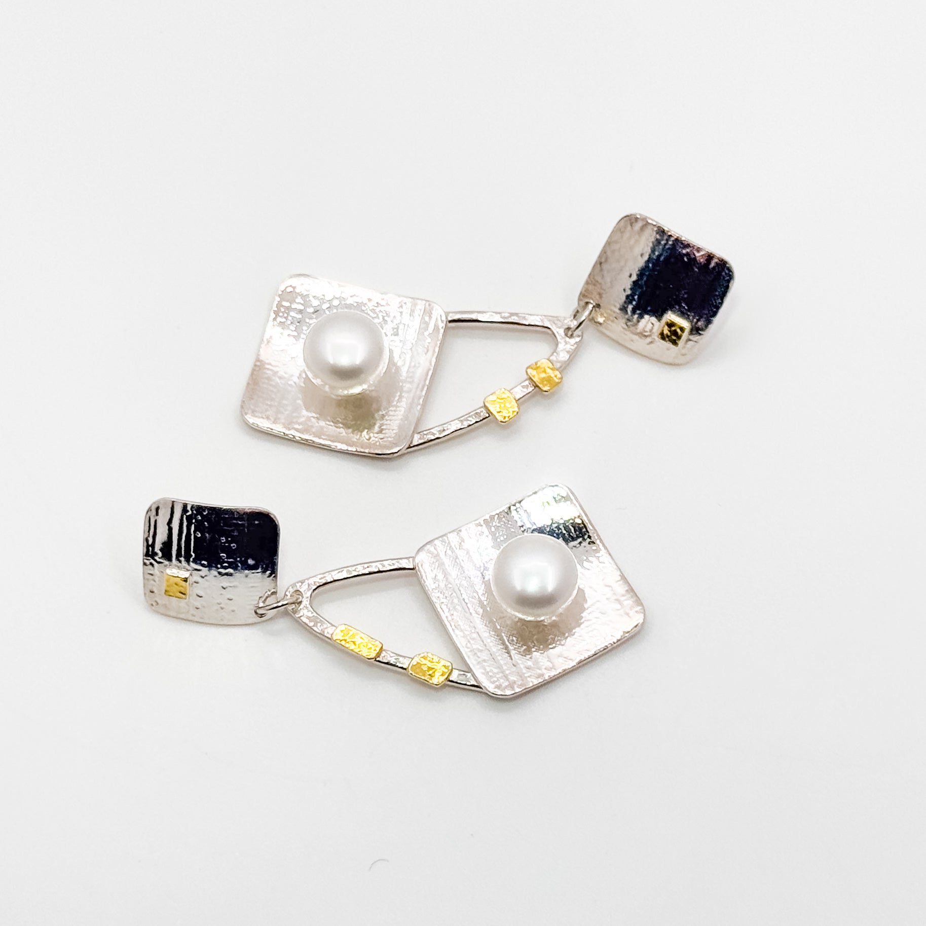 Pearl Power white button post earrings