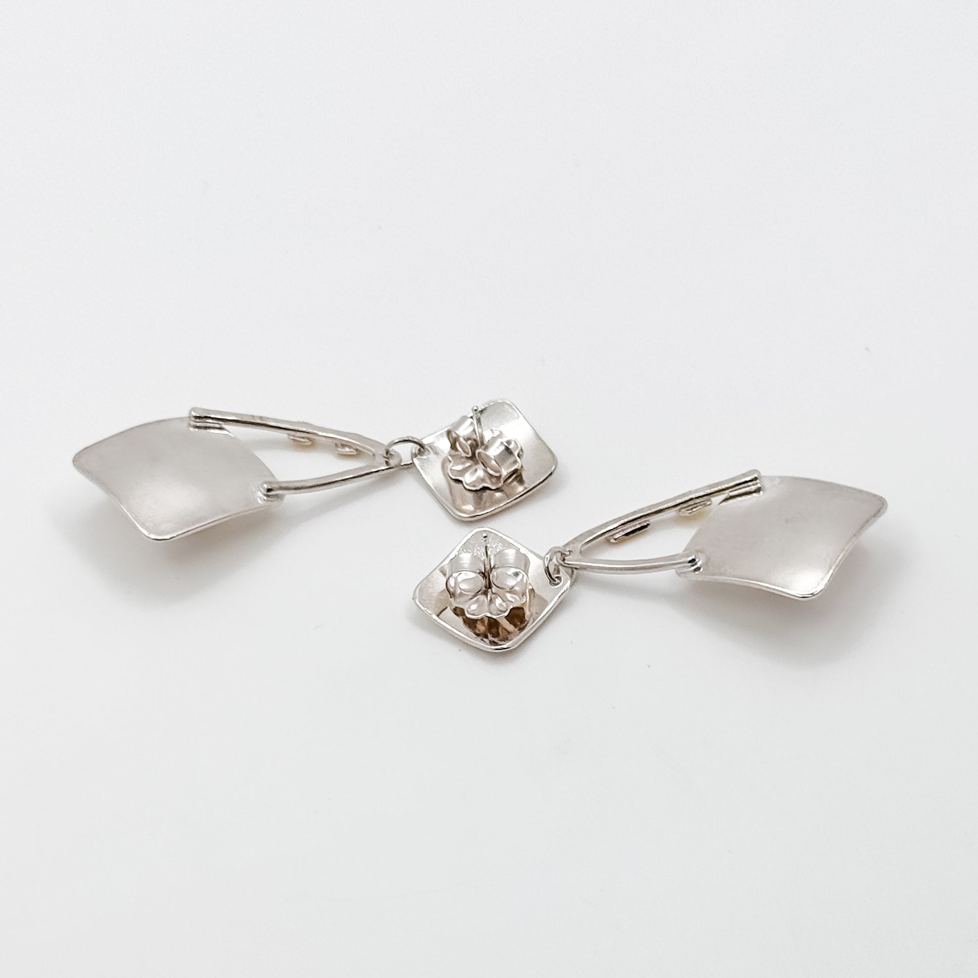 Pearl Power white button post earrings