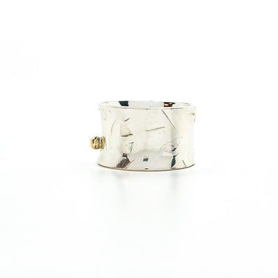 left side view of Sterling Anticlastic X Hammered Ring with 14k Ball by Judie Raiford
