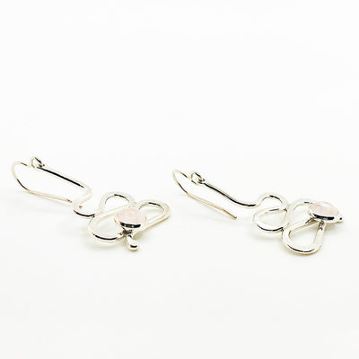 side angle view of Small Sterling Touch of Romance Earrings with Moonstone by Judie Raiford