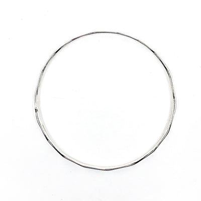 over top view of Sterling Orbit Bangle by Judie Raiford