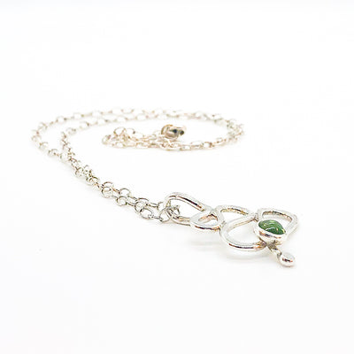 side angle view of sterling silver Touch of Romance Necklace with Peridot by Judie Raiford