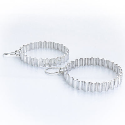 angle side view of Large Corrugated Hoop Earrings by Judie Raiford