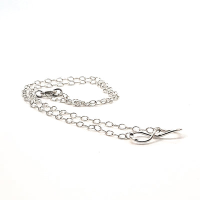 side angle view of sterling silver Infinity Maggie Necklace by Judie Raiford