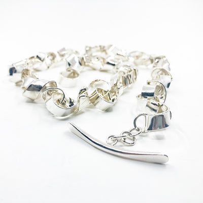 side angle view of Sterling Davine Necklace by Judie Raiford