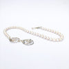 side view of White Pearl Double Swirl Necklace by Judie Raiford