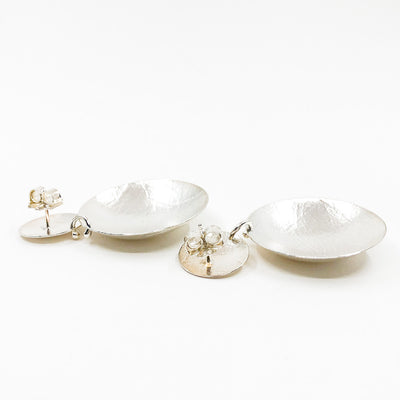 back side angle view of Sterling Textured Double Disc Earrings by Judie Raiford