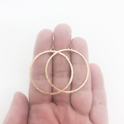 14k Gold Filled Mom's Hammer Flat Orbit Earrings by Judie Raiford held in hand