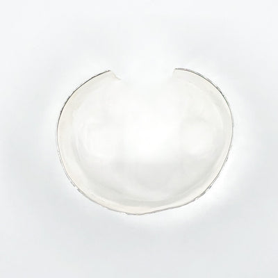 over top view of Sterling 1.5" Ball Pein Anticlastic Cuff by Judie Raiford