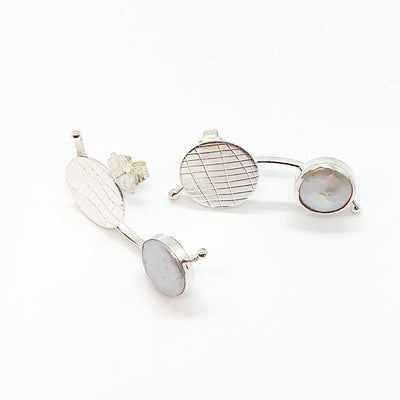 side angle view of Sterling Silver Comet Earrings with White Coin Pearl by Judie Raiford