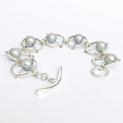 Side angle view of Not Naught Round Sterling Bracelet with Gray Pearls by Judie Raiford