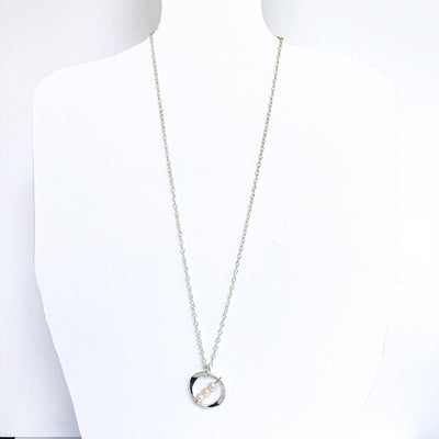 Large Naught Necklace with 3 White Pearls by Judie Raiford on a mannequin