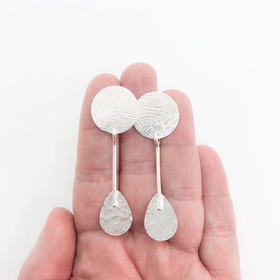 sterling silver Jodell Earrings by Judie Raiford held in hand