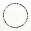 over top view Double Twist Oxidized Sterling Bangle by Judie Raiford