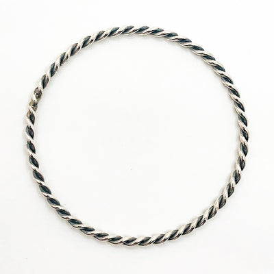 over top view Double Twist Oxidized Sterling Bangle by Judie Raiford