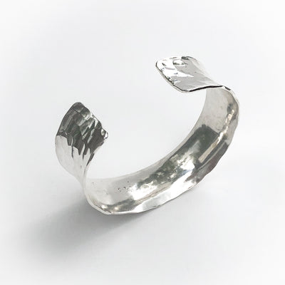 angle view of Sterling Anticlastic Ball Pein Cuff by Judie Raiford