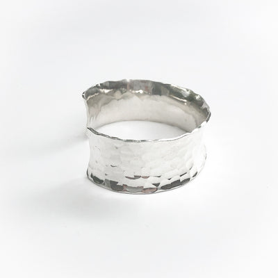 other side view of Sterling Anticlastic Ball Pein Cuff by Judie Raiford