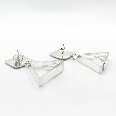 back side view of Sterling Disc Top Teepee Earrings by Judie Raiford