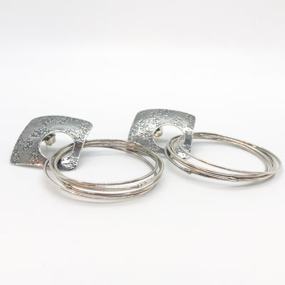 side angle view of Oxidized Sterling Square Top Slinky Post Earrings by Judie Raiford