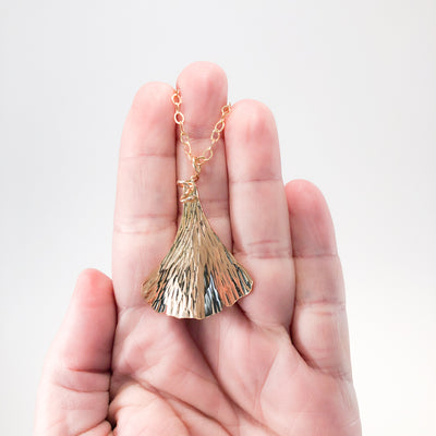 14k Gold Filled Ginkgo Necklace by Judie Raiford held in hand