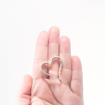 Small Jane Heart Necklace by Judie Raiford held in hand