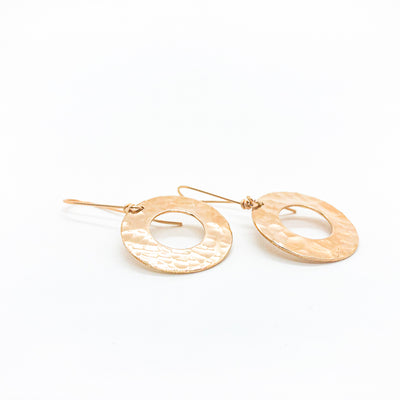 side angle view of 14k Gold Filled Ball Pein Donut Earrings on handmade wire by Judie Raiford