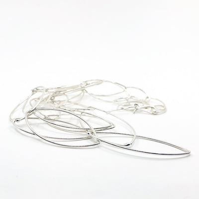 side angle view of Sterling Triple Strand Baguette Necklace by Judie Raiford