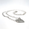 side angle view of sterling silver Stationary Heart Layering Necklace by Judie Raiford