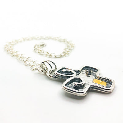 side angle view of Big Honker Cross Necklace by Judie Raiford