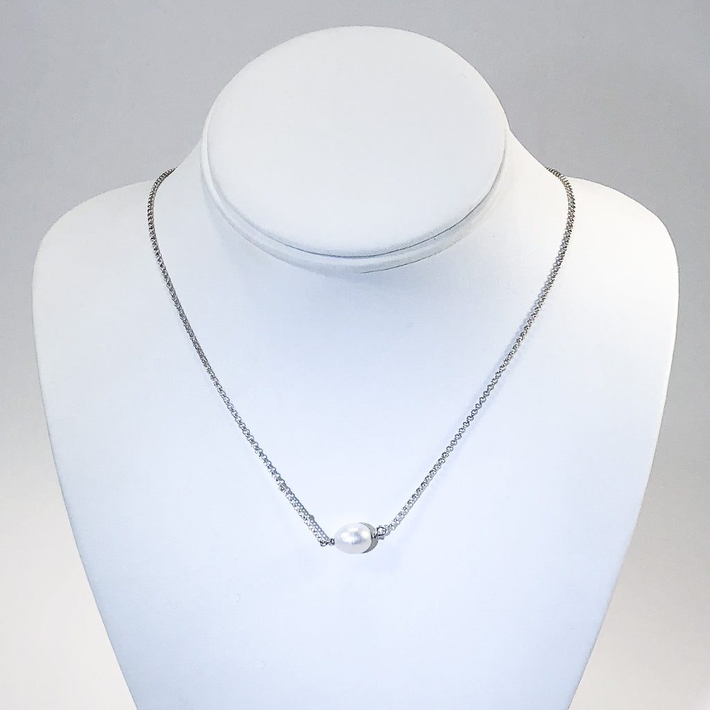 Baroque Pearl Necklace by Judie Raiford on white display bust