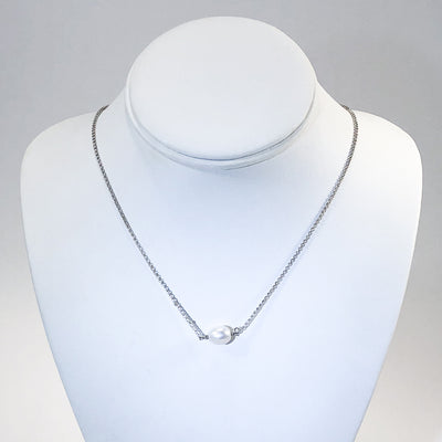 Baroque Pearl Necklace by Judie Raiford on white display bust