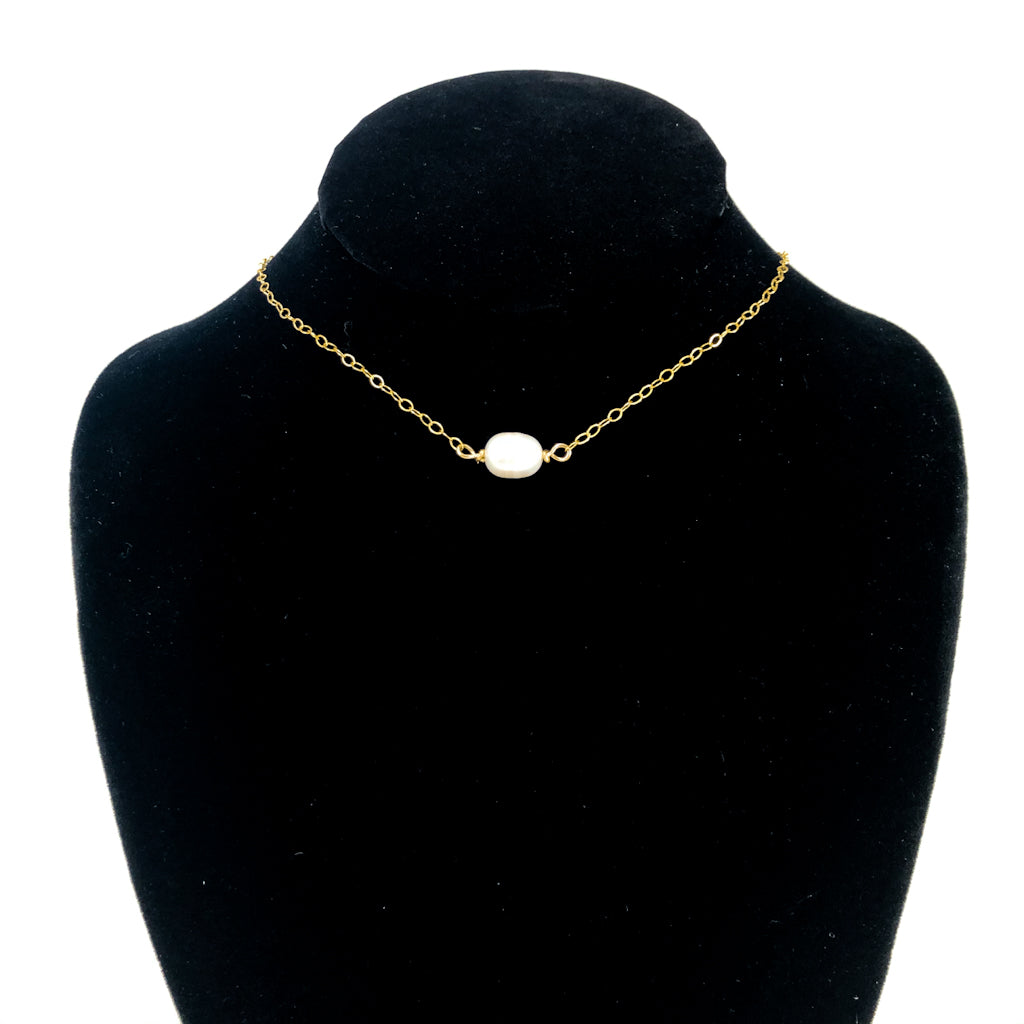 White Baroque Pearl on 14k Gold Chain Necklace by Judie Raiford displayed on black mannequin bust