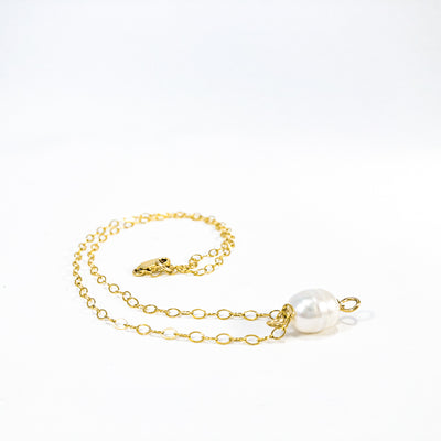 side angle view of White Baroque Pearl on 14k Gold Chain Necklace by Judie Raiford