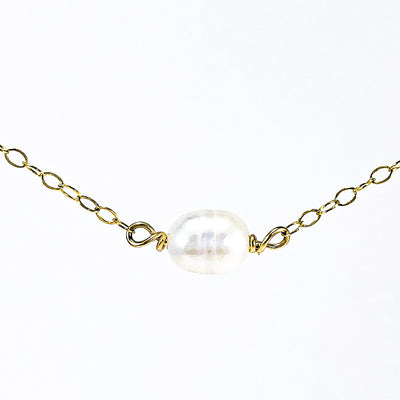 detail view of White Baroque Pearl on 14k Gold Chain Necklace by Judie Raiford