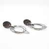 side angle view of Oxidized Sterling Silver Oval Top with 3 Dangles Earrings by Judie Raiford