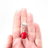 sterling silver Big Juicy Stone Necklace with Red Coral by Judie Raiford held in hand