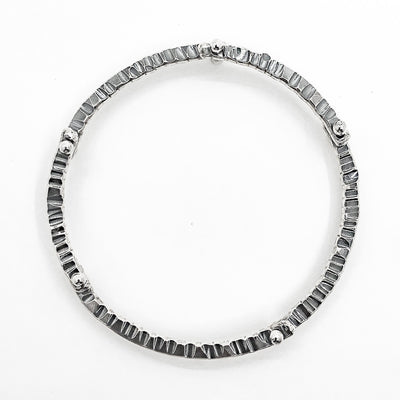 over top view of Oxidized Sterling Industrial Bangle by Judie Raiford
