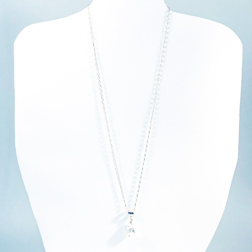 White Baroque Pearl on Sterling Long Short Chain by Judie Raiford on white mannequin display bust
