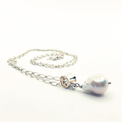 side angle view of White Baroque Pearl on Sterling Long Short Chain by Judie Raiford