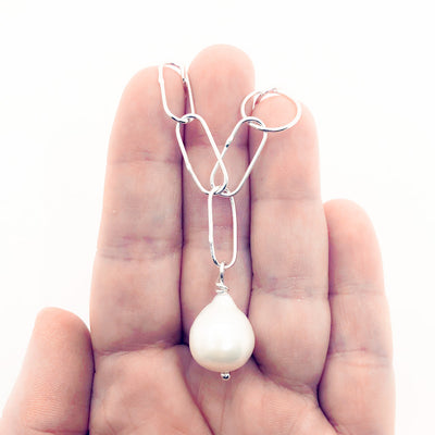 Baroque Pearl on Handmade Chain Necklace by Judie Raiford held in hand