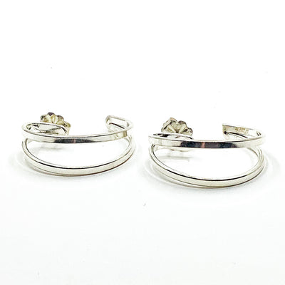 side angle view of Sterling Looped End Earrings by Judie Raiford