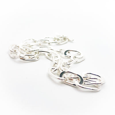 side angle view of Sterling Junior Tow Truck Necklace by Judie Raiford