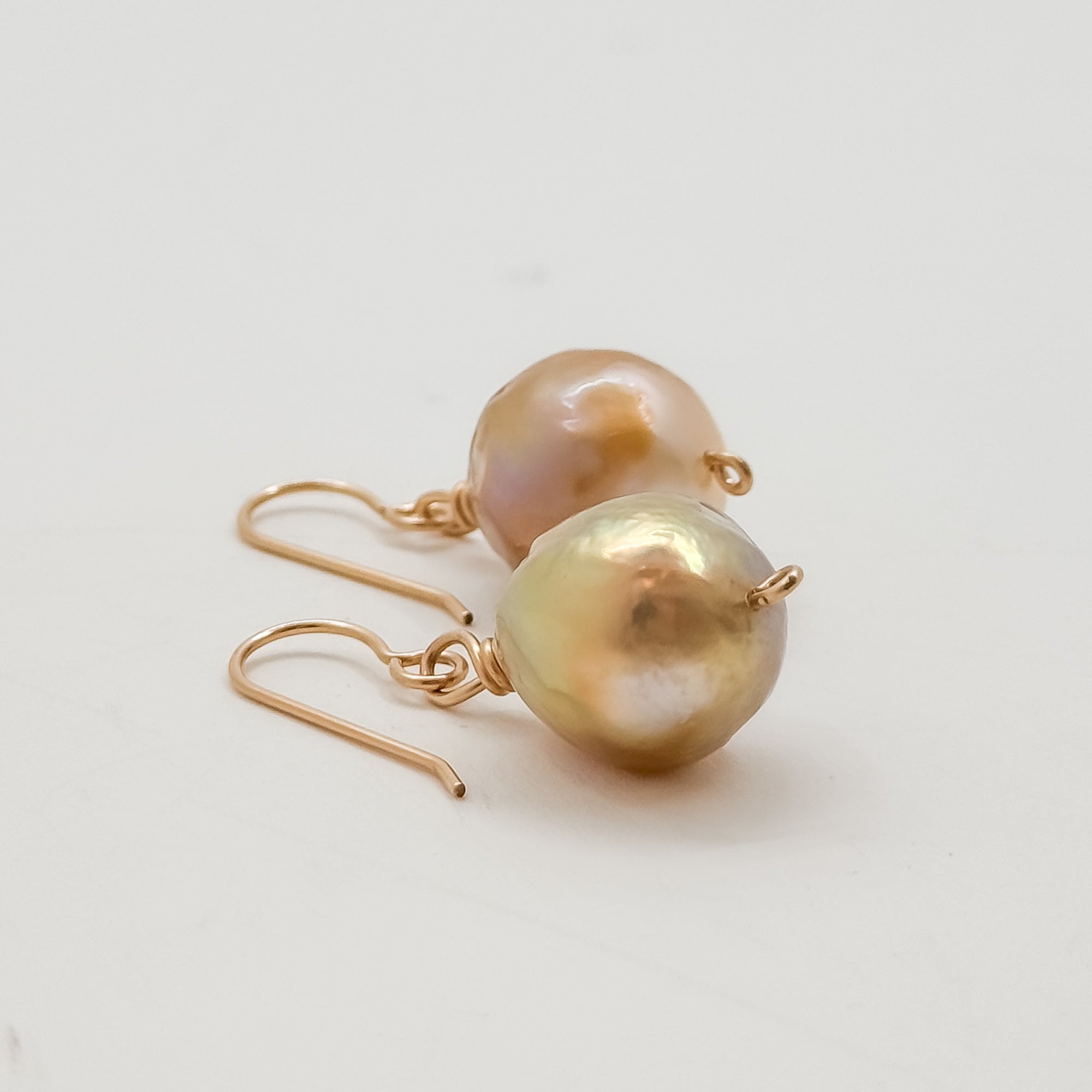 Single large Champagne Baroque pearl earrings